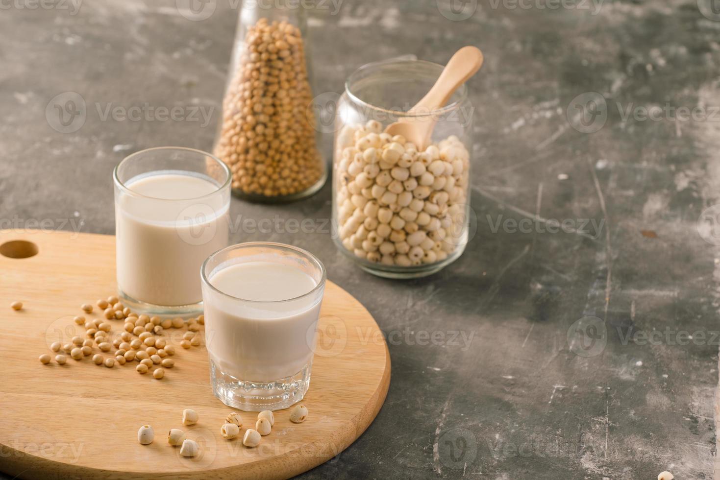 Glasses of lotus seed milk and soy milk on table. photo