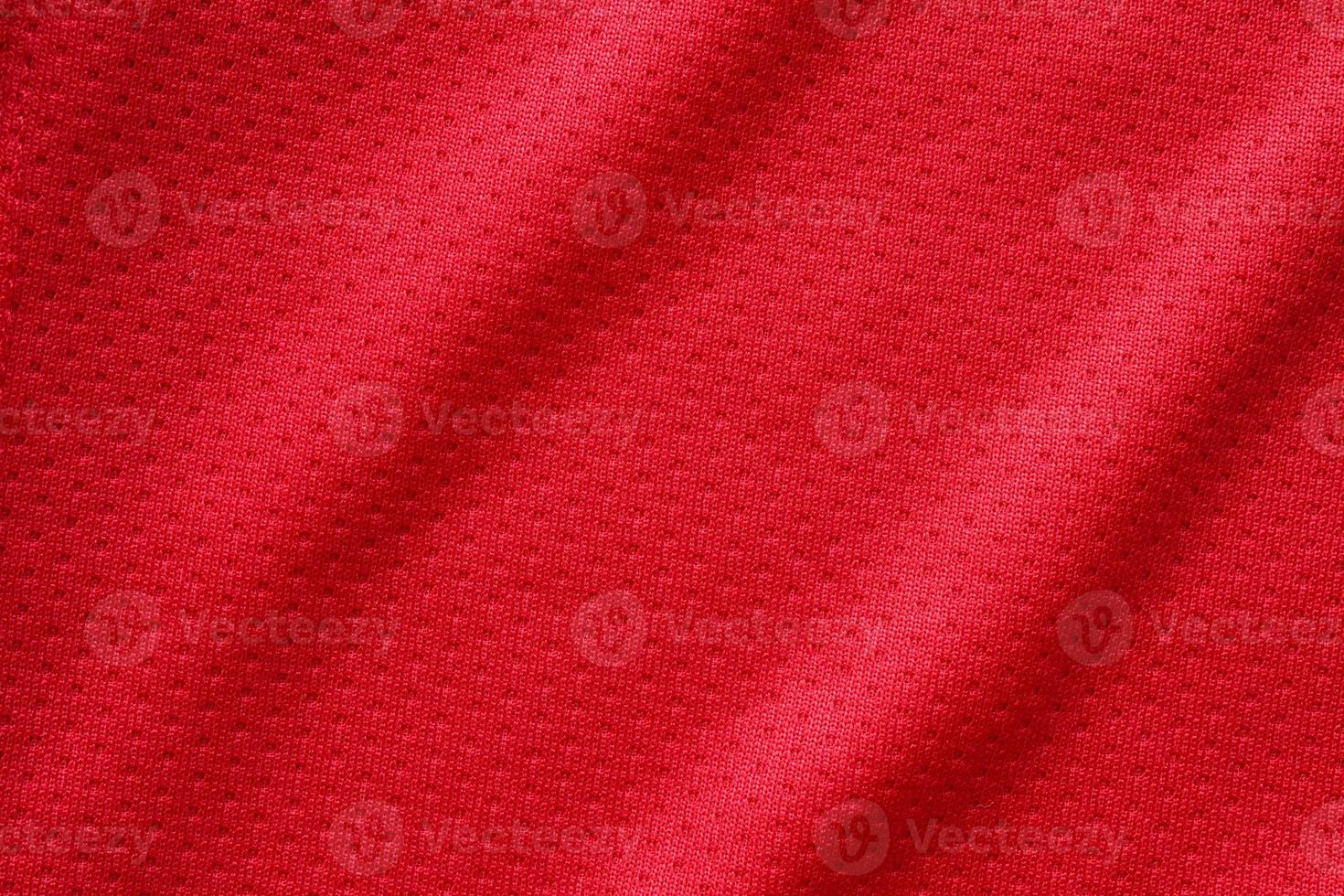 Red sports clothing fabric football shirt jersey texture close up photo