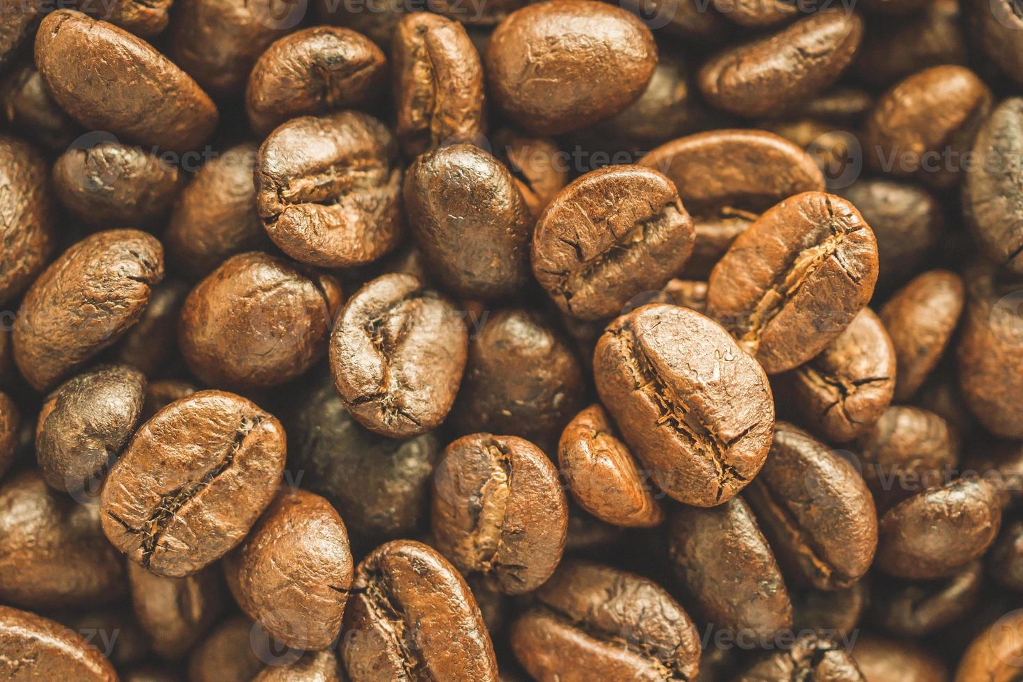 Roasted coffee beans closeup texture background photo