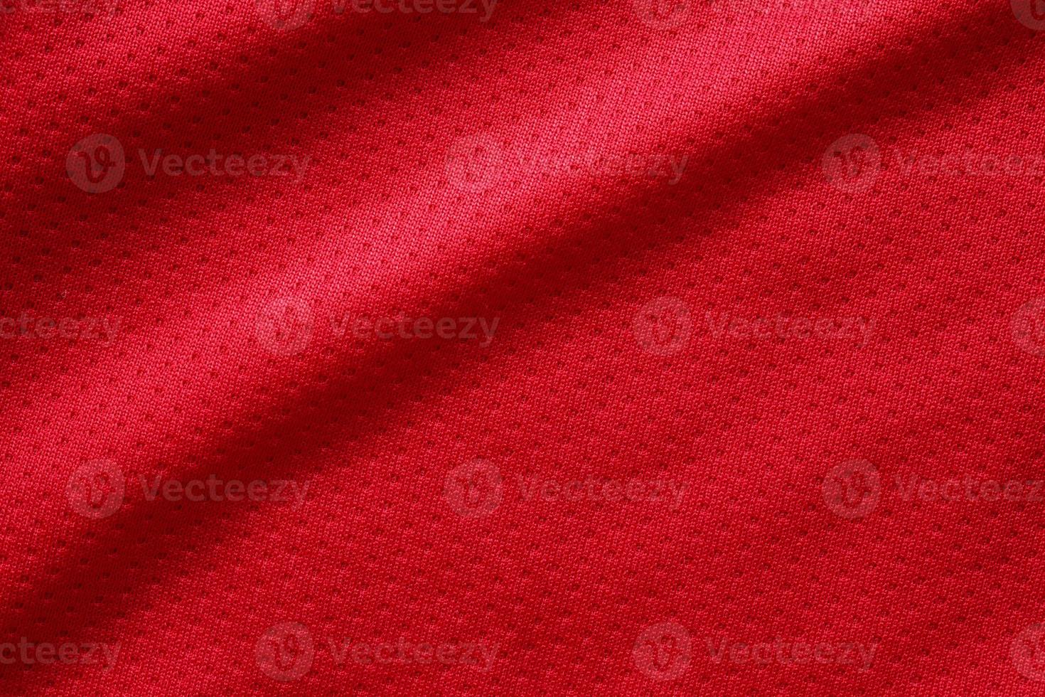 Red sports clothing fabric football shirt jersey texture close up photo