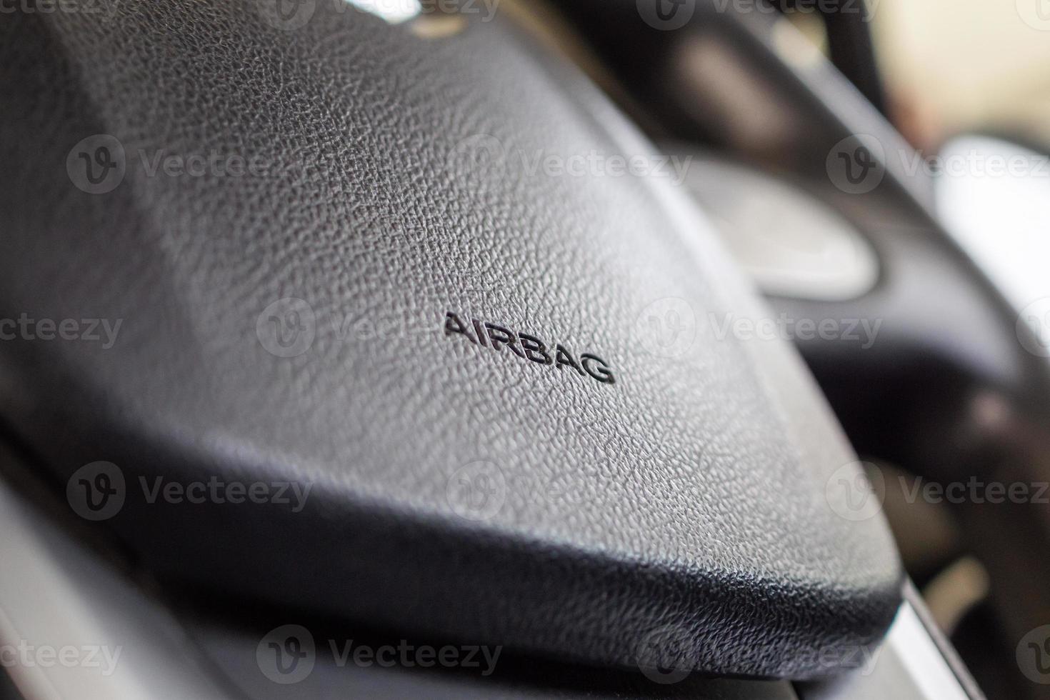 Safety airbag sign on car steering wheel photo