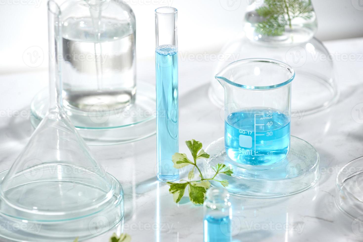 cosmetic laboratory research and development . science bio skincare cream serum product with leaves. natural organic beauty cosmetics concept. cosmetology. photo