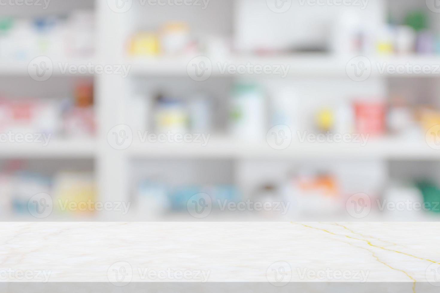 Empty white marble counter top with blur pharmacy drugstore shelves background photo