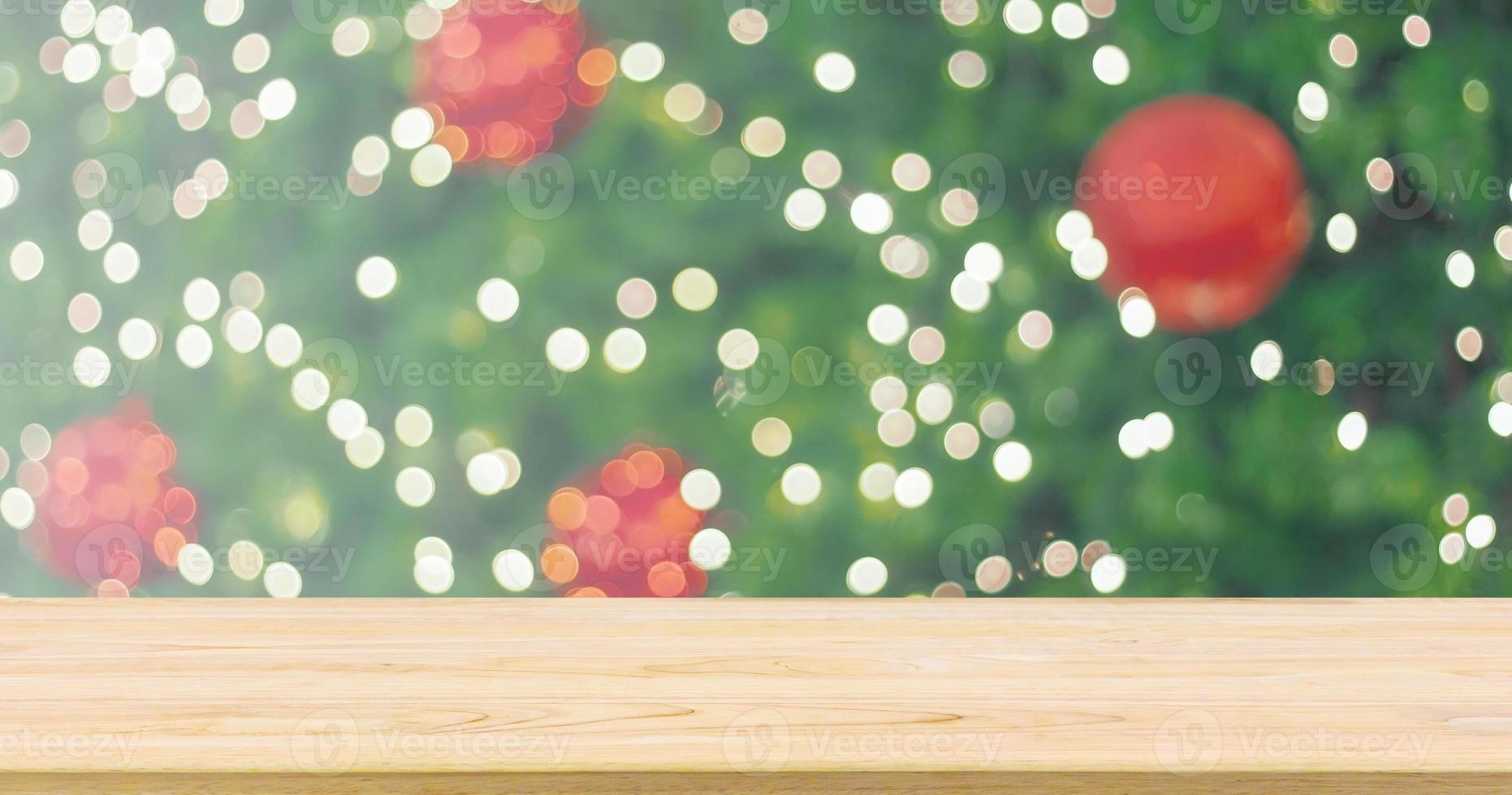 Empty wood table top with Abstract blur Christmas tree with decoration bokeh light background for product display photo