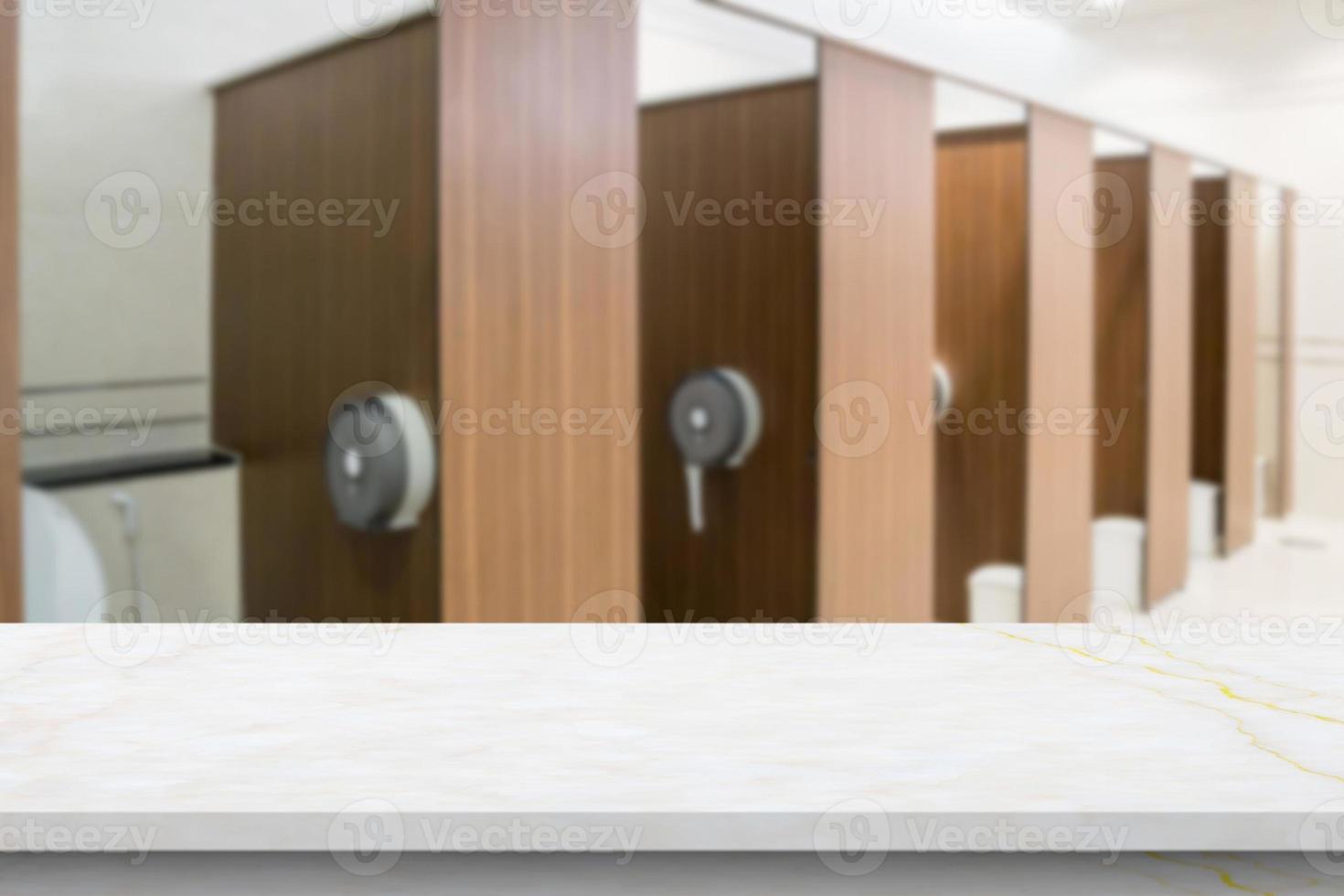Empty white marble table top with blur bathroom background photo