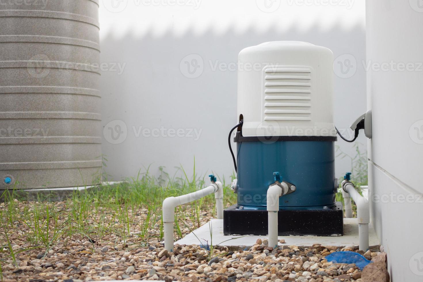 automatic water pump station outside the house photo