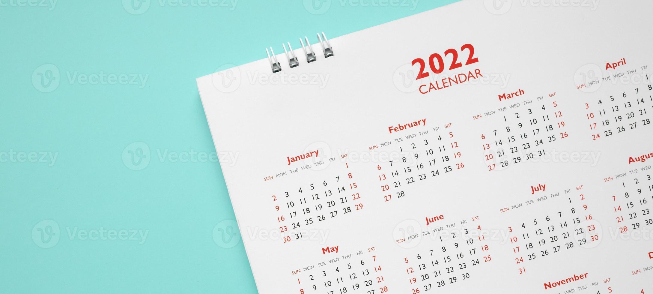 2022 calendar page on blue background business planning appointment meeting concept photo