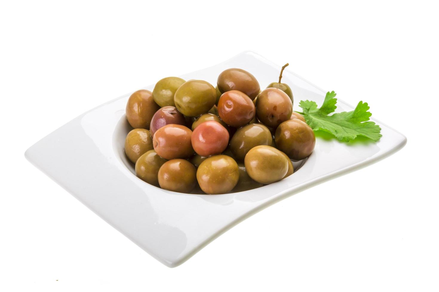 Marinated olives on white photo