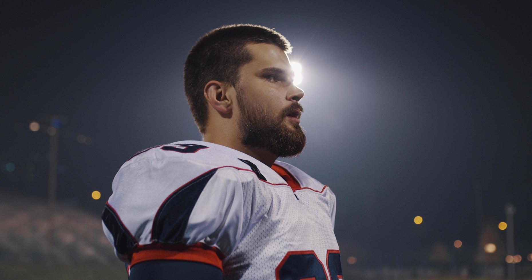 portrait of young confident American football player photo