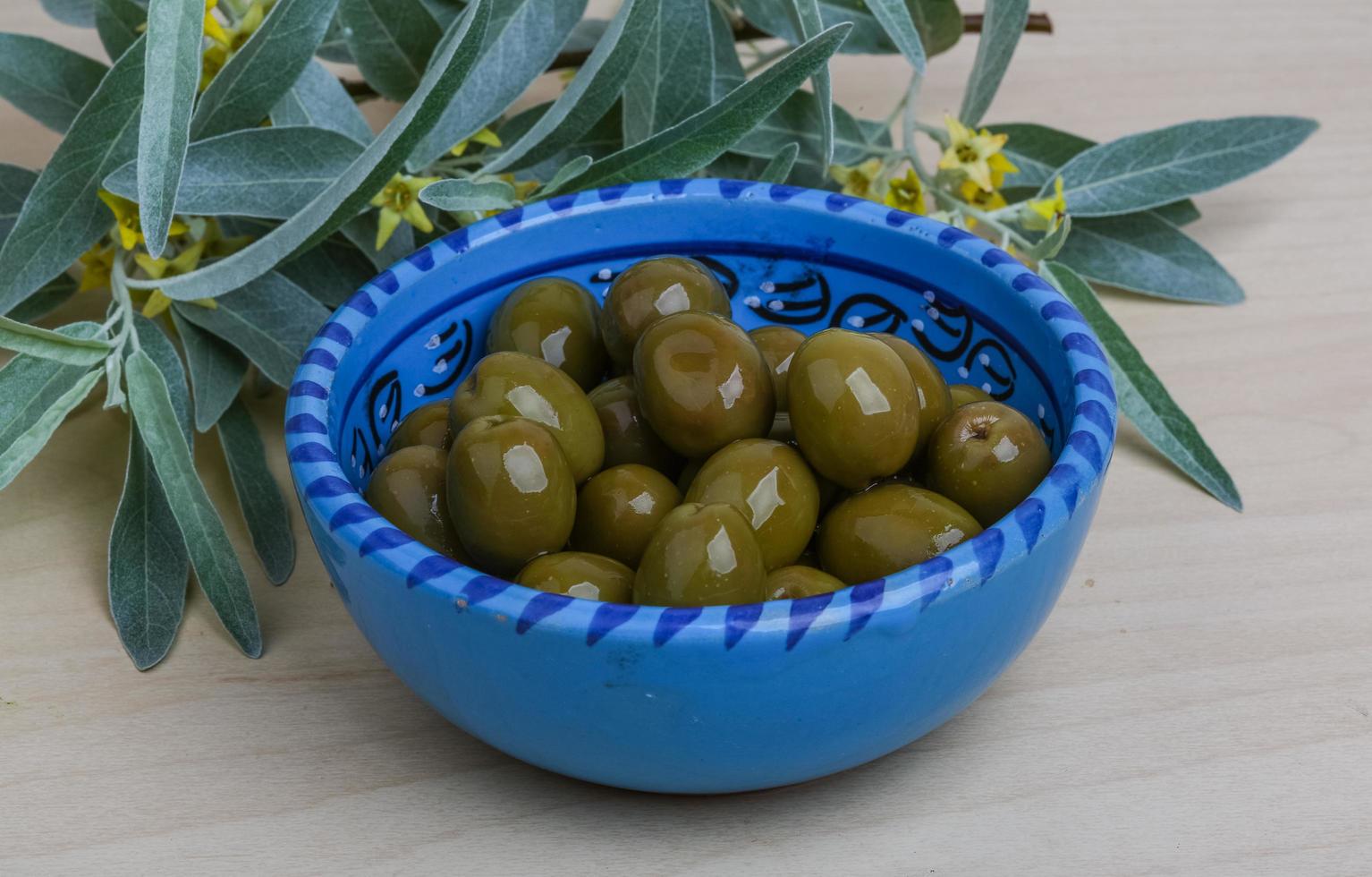 Green olives dish 12727957 Stock Photo at Vecteezy