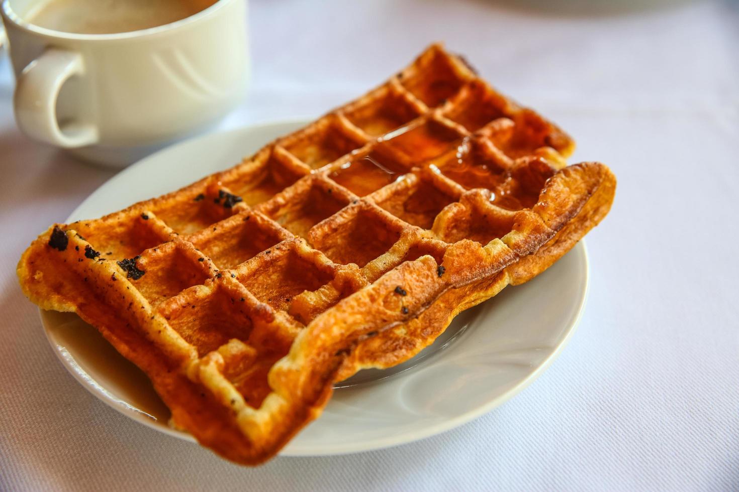 Belgian waffle on the plate and white background photo
