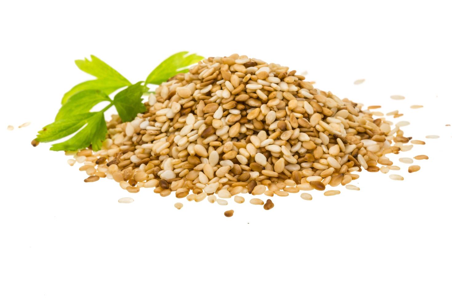 Sesame seeds on white photo
