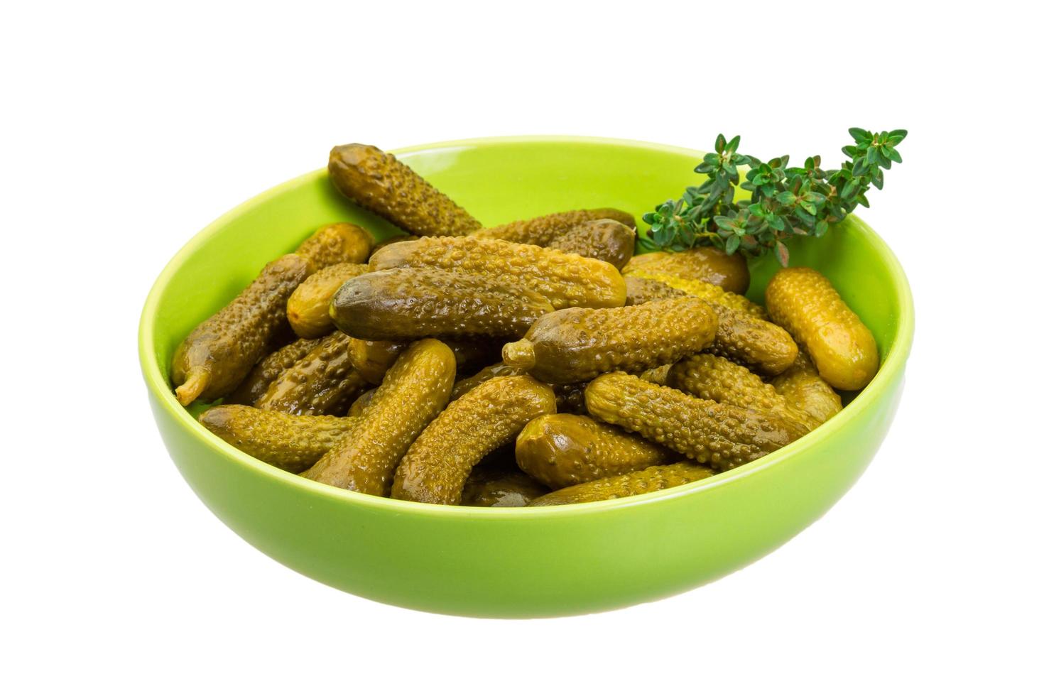 Marinated cucumbers on white photo