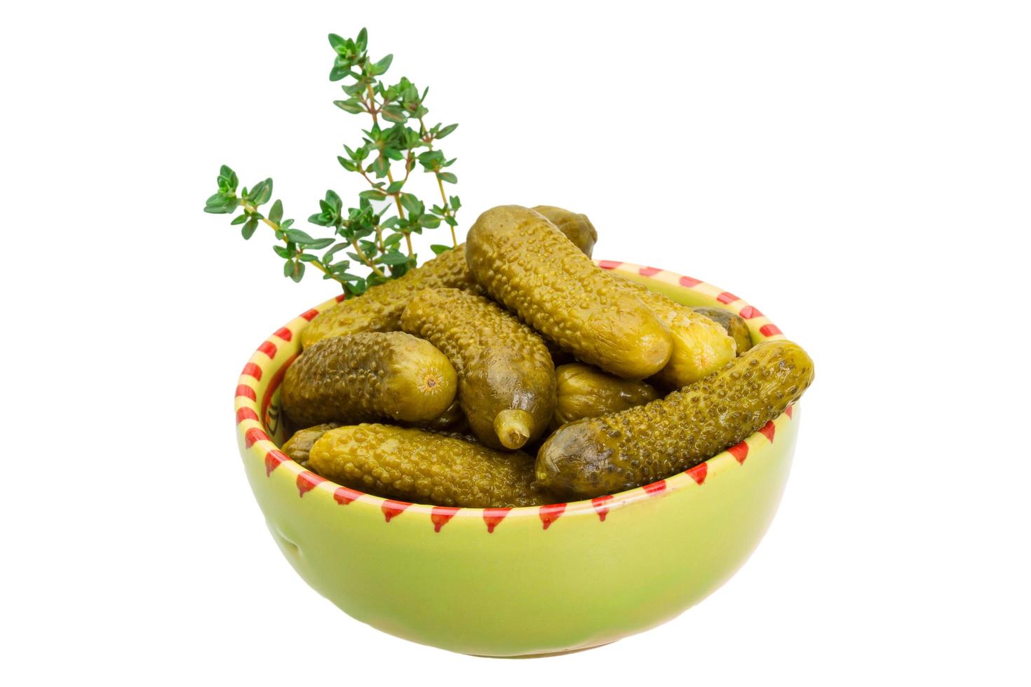 Marinated cucumbers on white photo