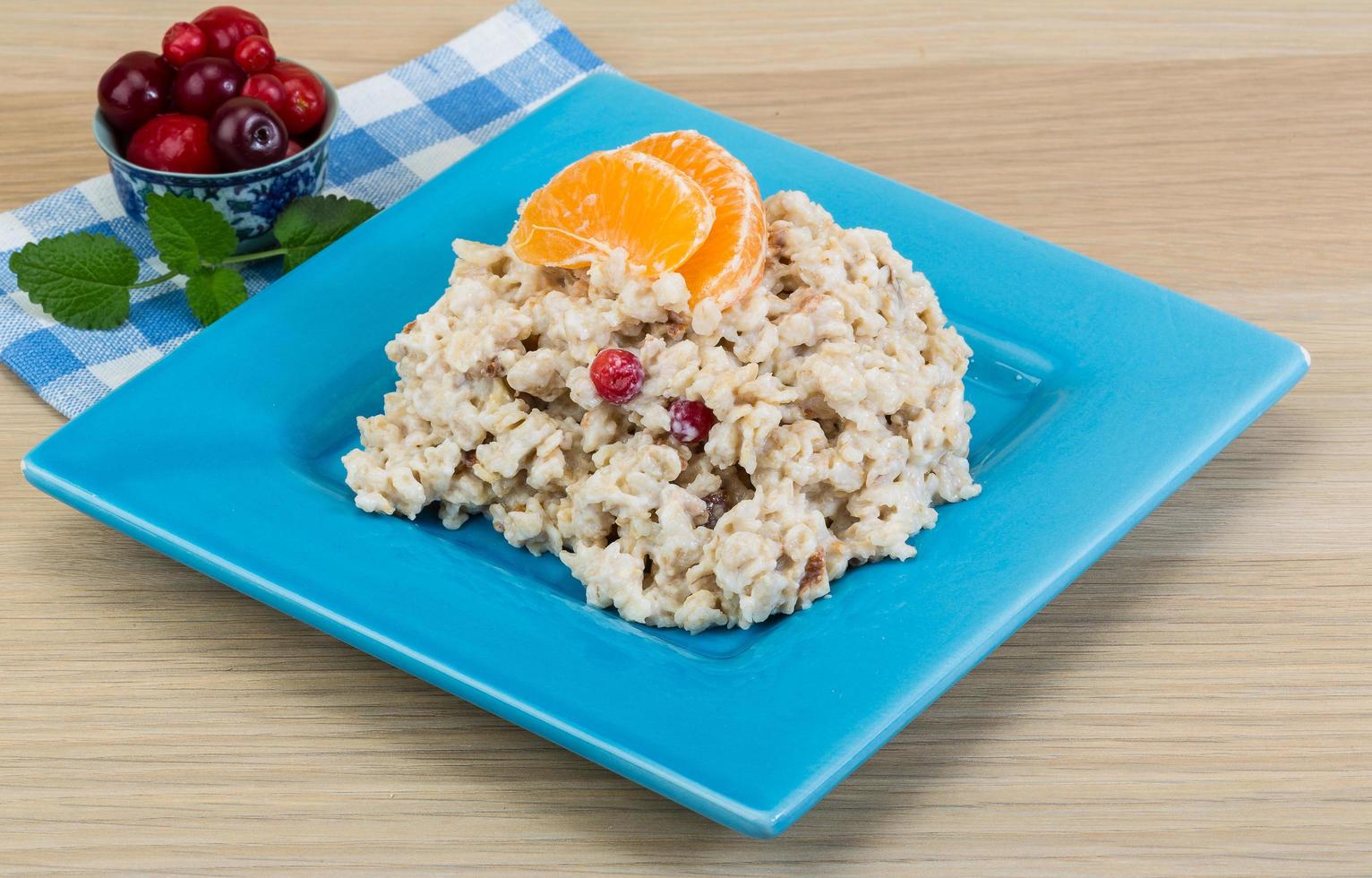 Oatmeal on wood photo