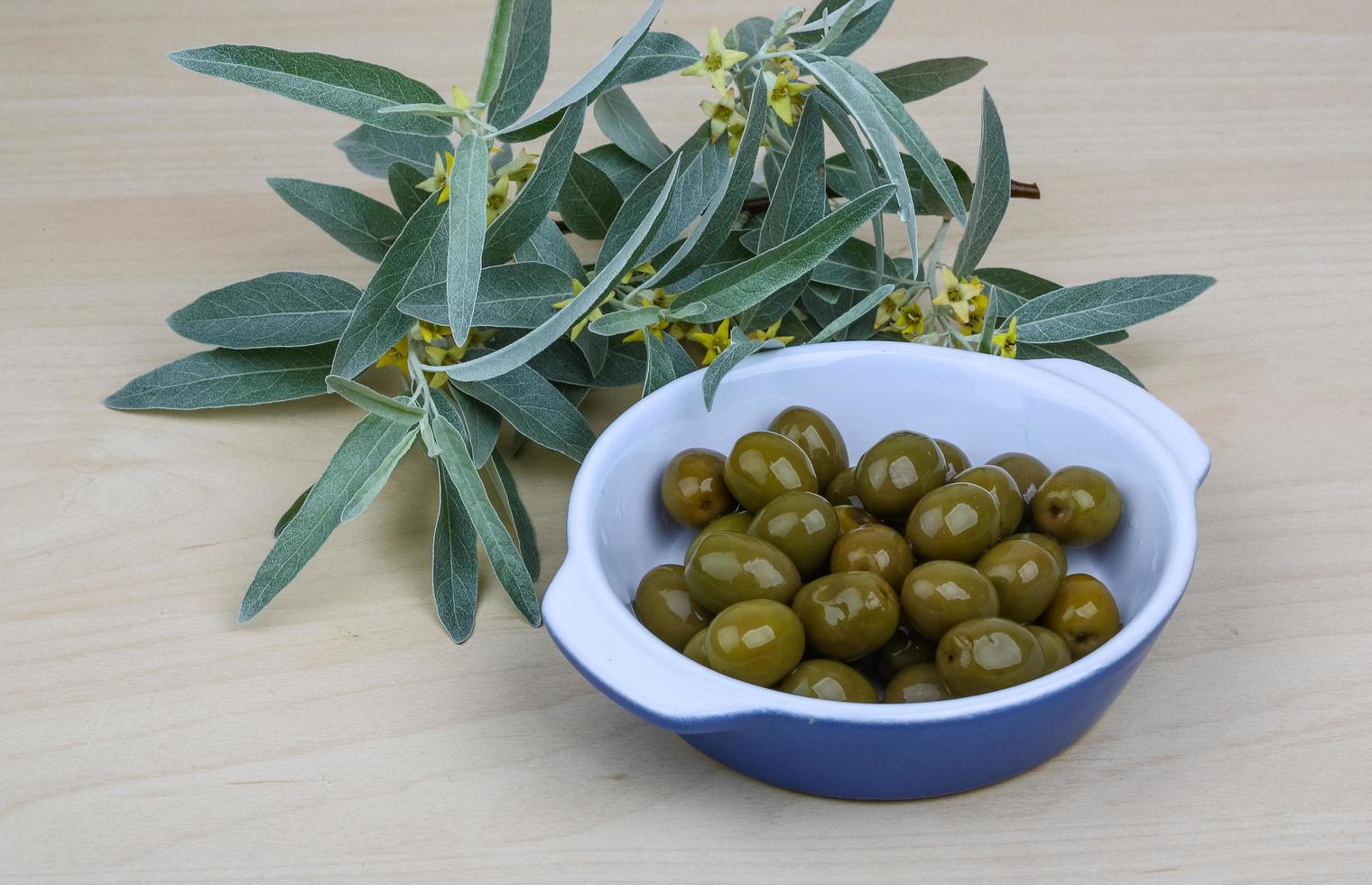 Green olives dish photo