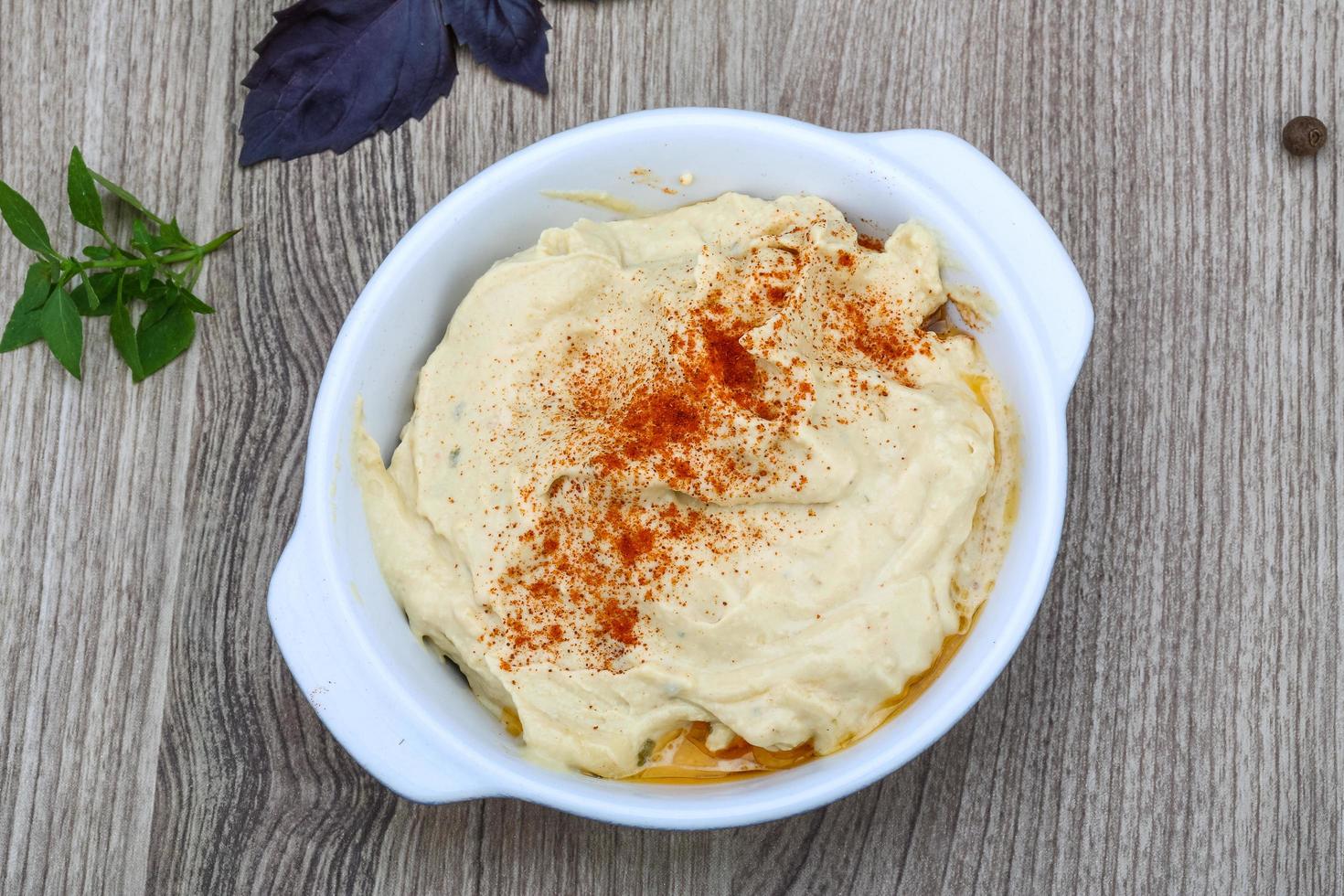 Hummus in dish photo
