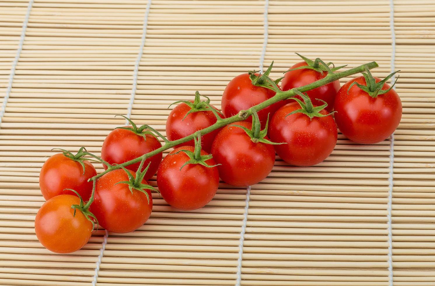 Cherry tomatoes on wood photo