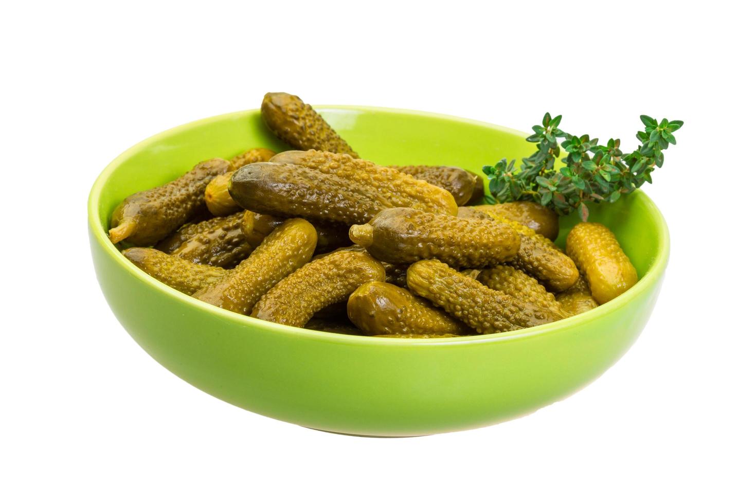 Marinated cucumbers on white photo