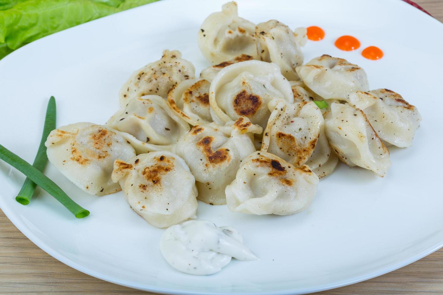 Roasted pierogi on wood photo