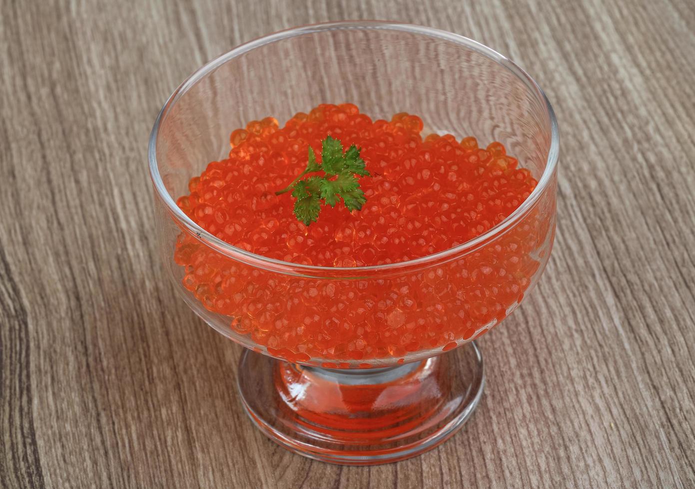 Red caviar on wood photo