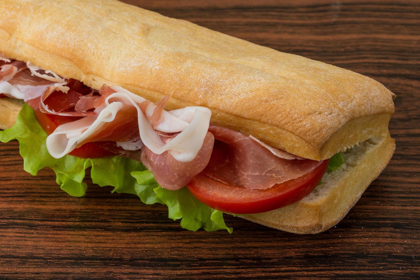 Ham sandwich on wood photo