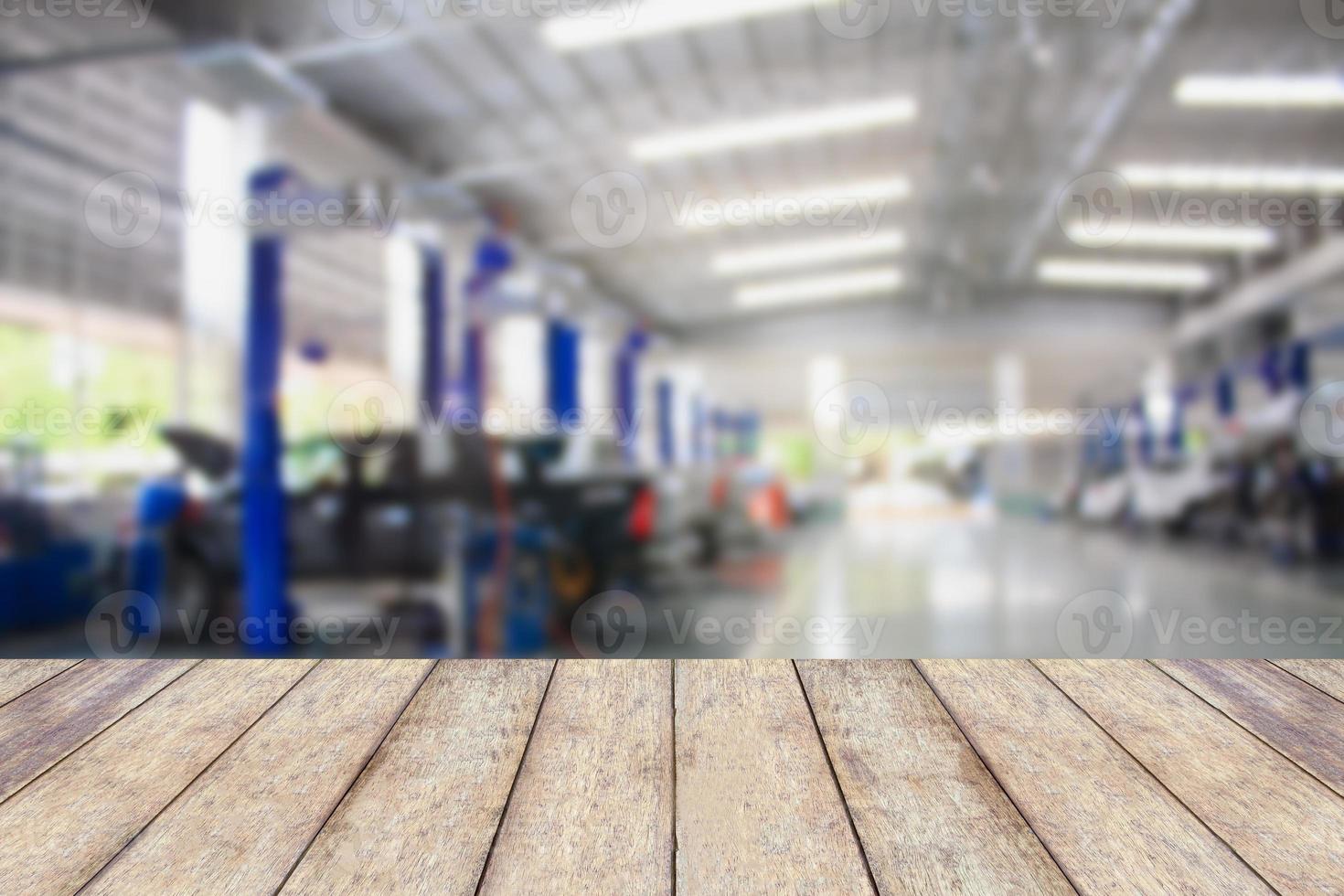 Wood table top with blur garage background photo