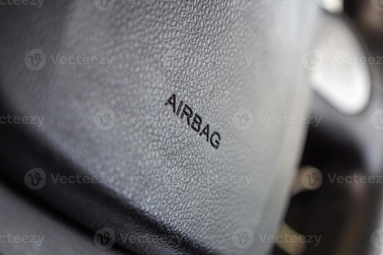 Safety airbag sign on car steering wheel photo