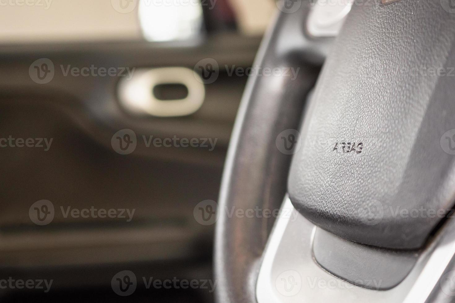 Safety airbag sign on car steering wheel photo