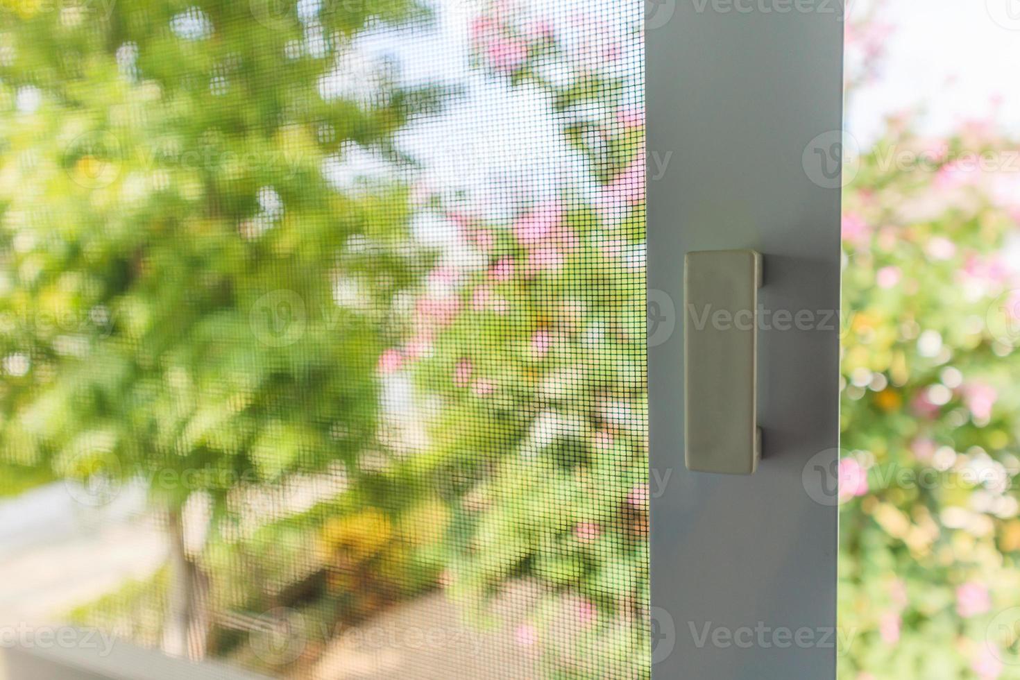mosquito net wire screen on house window protection against insect photo