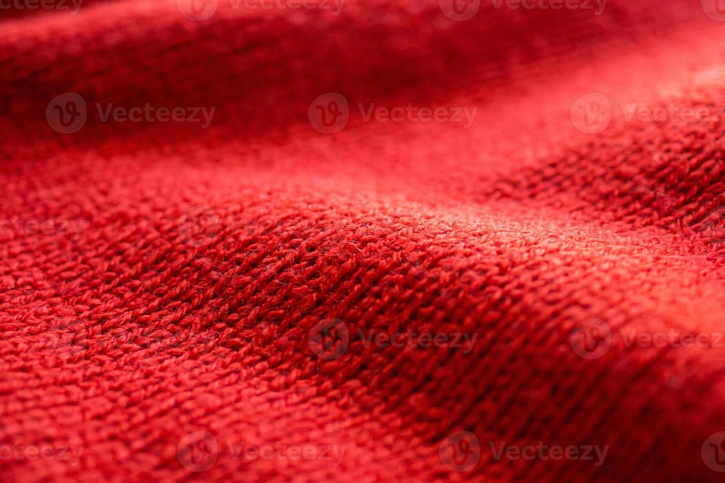 closeup red knitted woolen fabric texture background photo