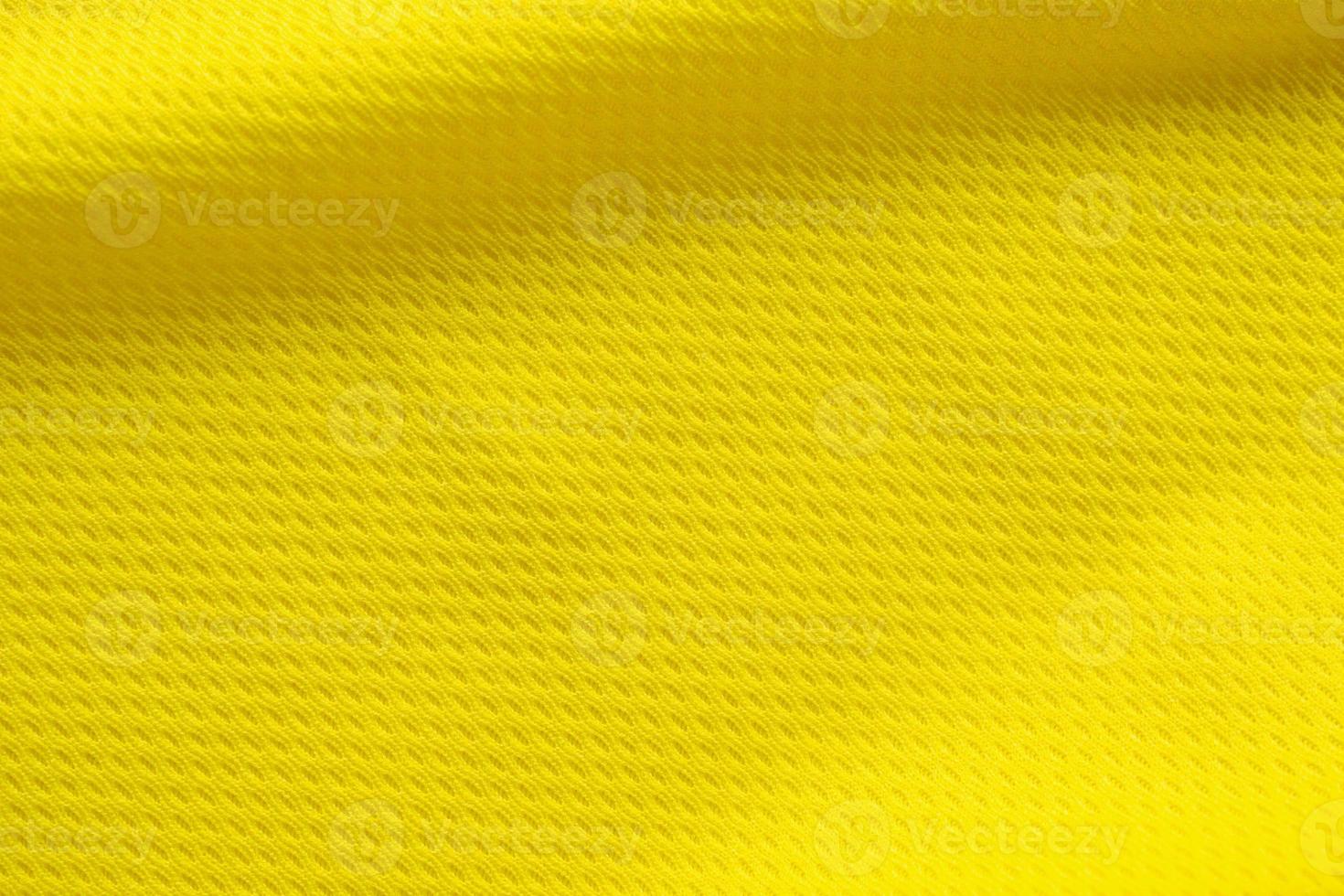 Color amarillo camiseta de fútbol ropa tela textura ropa deportiva fondo, primer plano foto