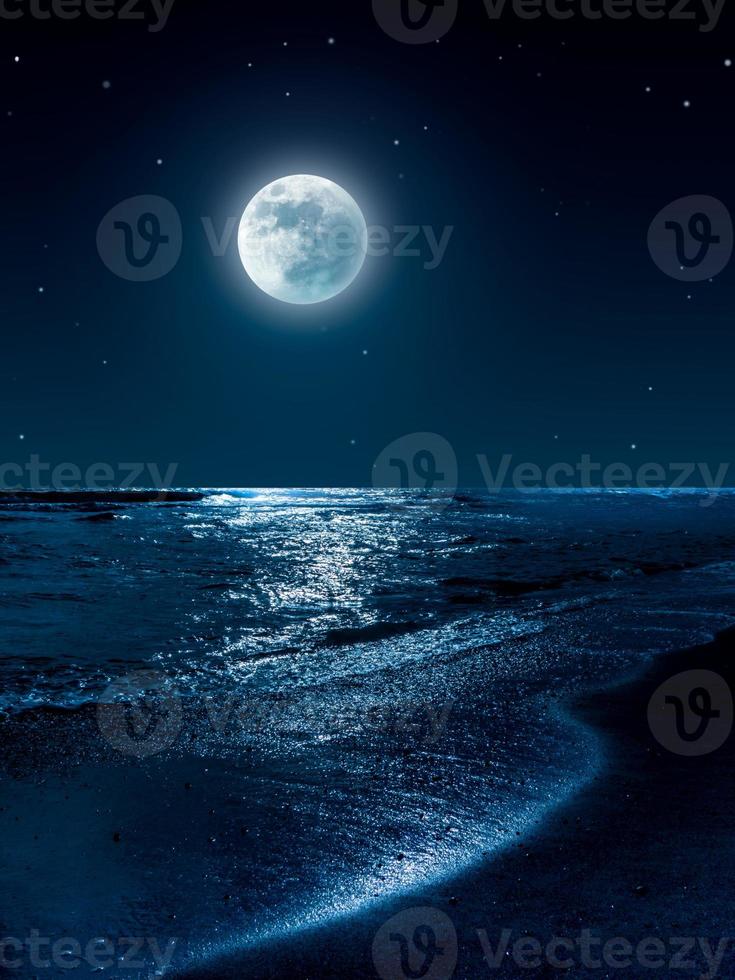 Moon and stars over the sea photo