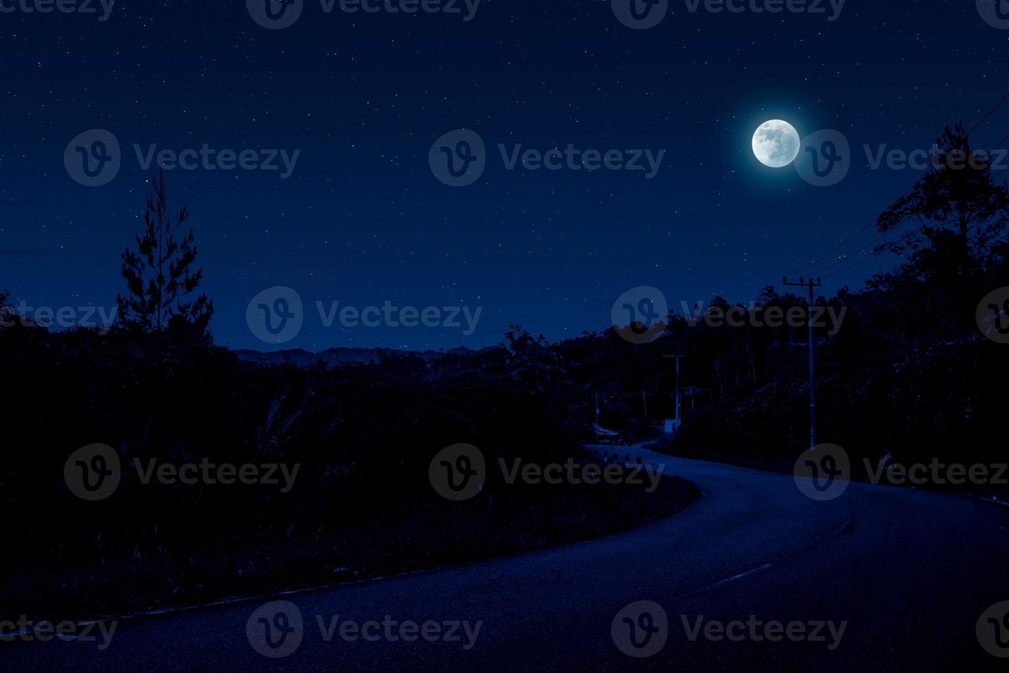 Night scene in village with empty road photo