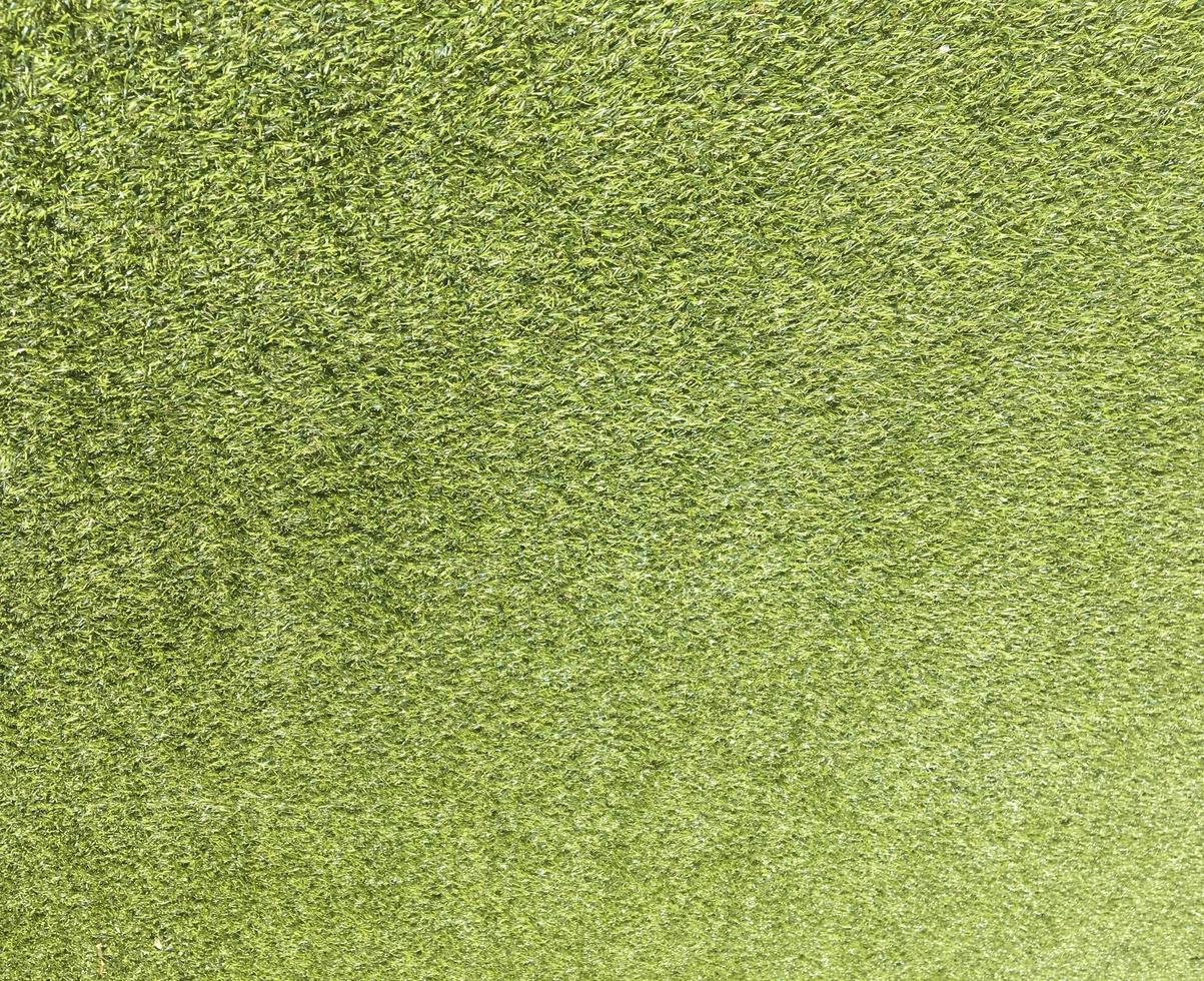 Artificial green lawn backyard for background. Texture for design photo
