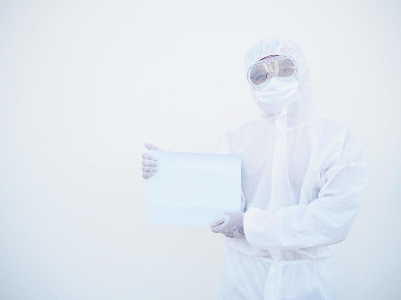 Young doctor or scientist in PPE suite uniform holding blank paper for text with both hands While looking ahead. coronavirus or COVID-19 concept isolated white background photo