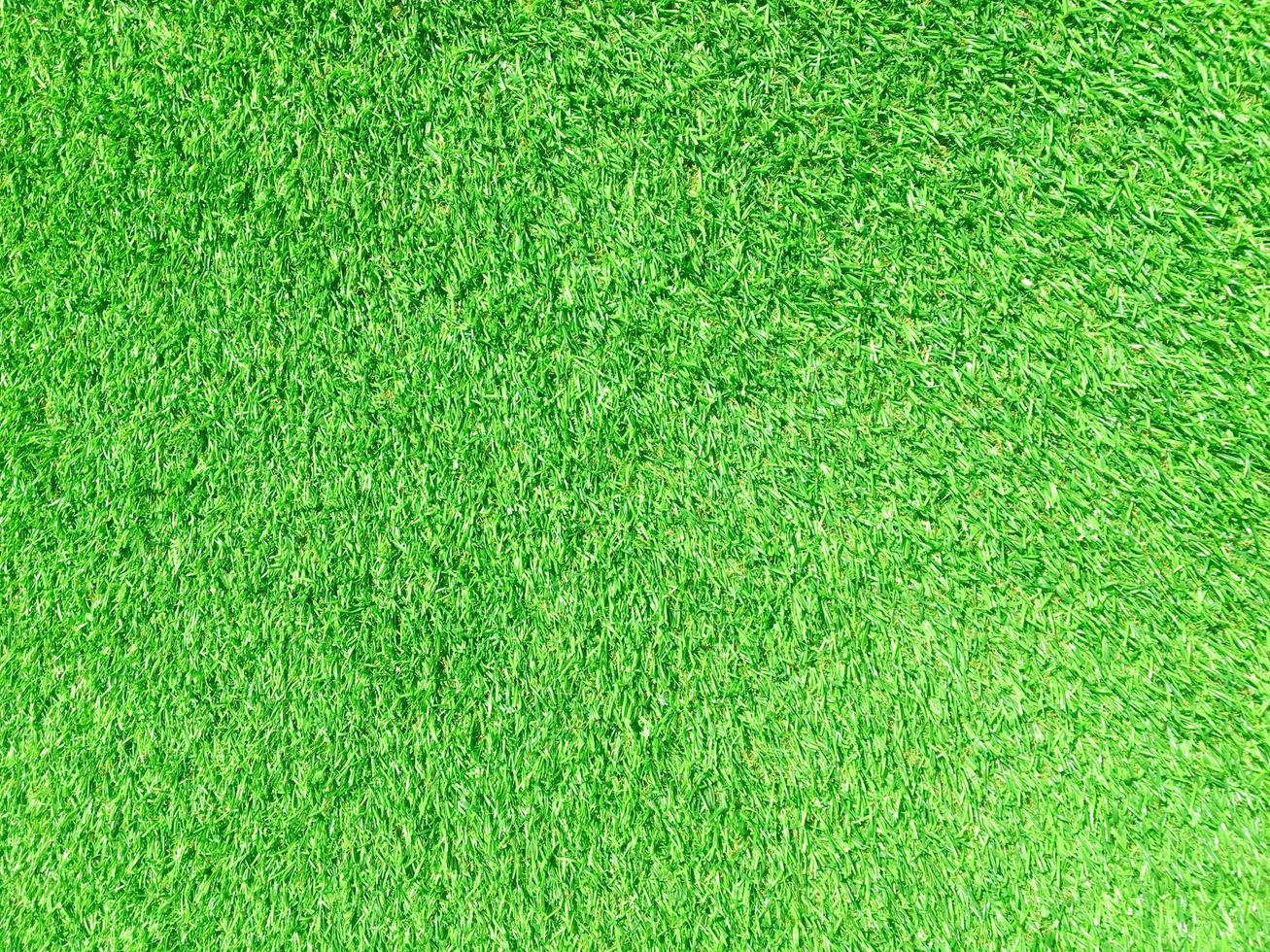 Artificial green lawn backyard for background. Texture for design photo