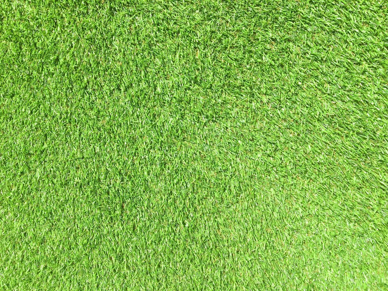 Artificial green lawn backyard for background. Texture for design photo