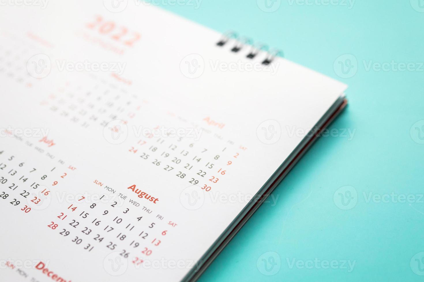 2022 calendar page on blue background business planning appointment meeting concept photo