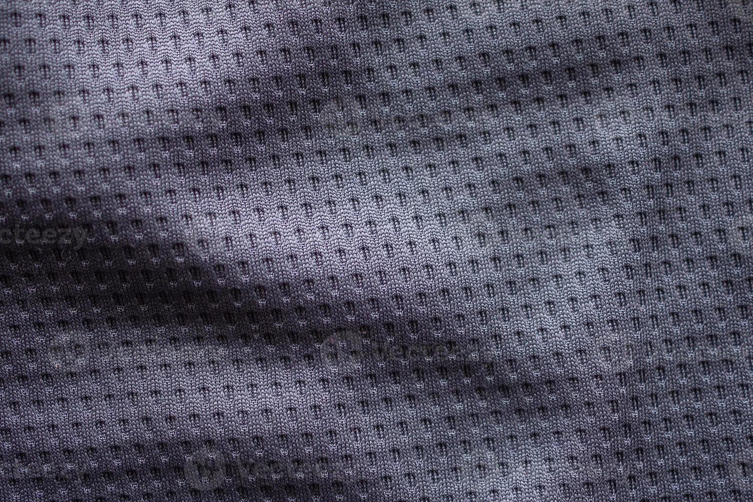 Gray fabric sport clothing football jersey with air mesh texture background photo