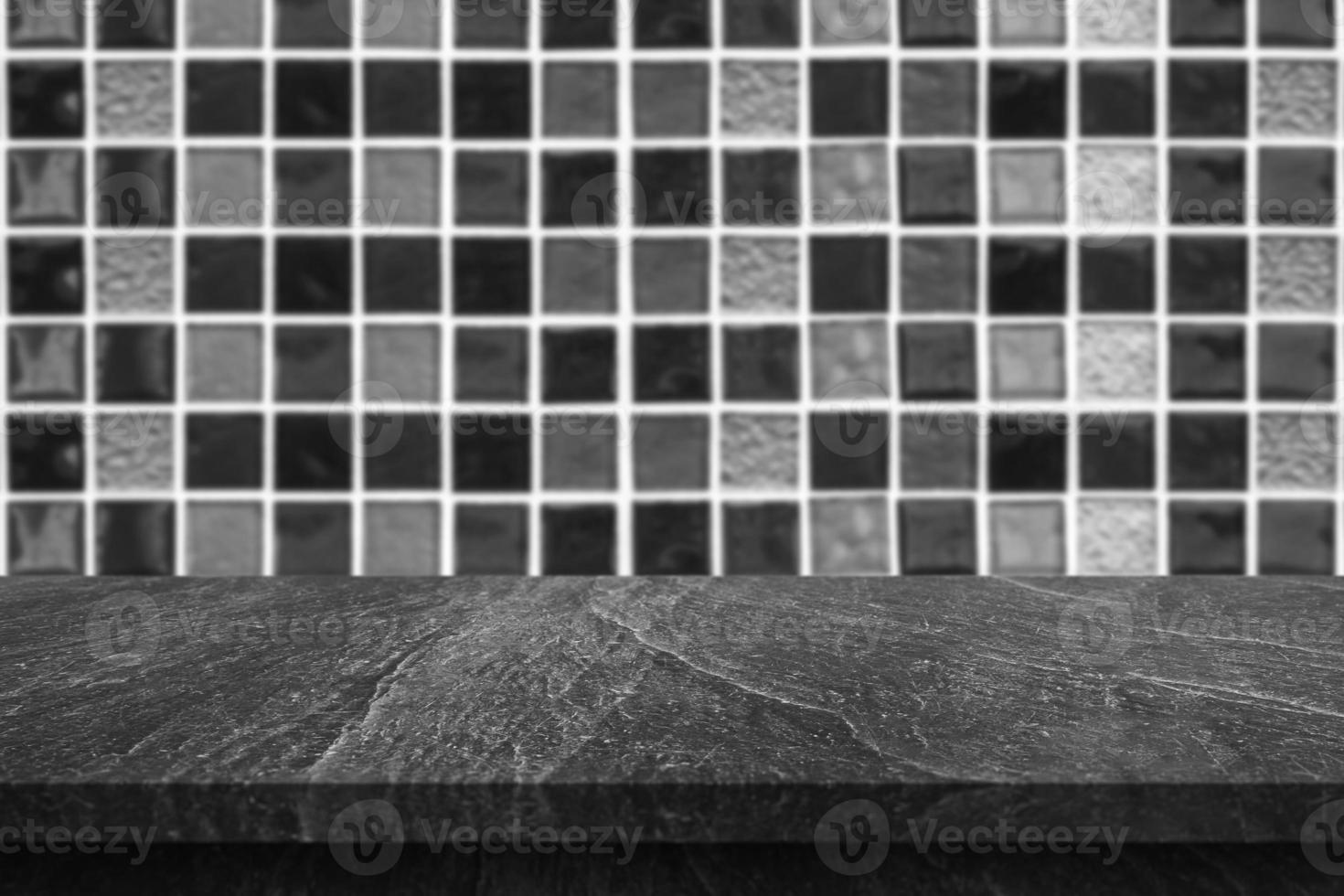 Empty black marble table top with blur tile wall bathroom background photo