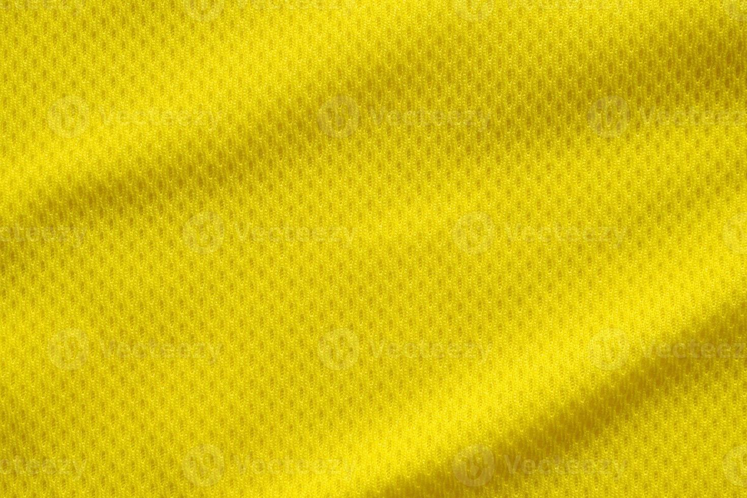 Yellow color football jersey clothing fabric texture sports wear background, close up photo