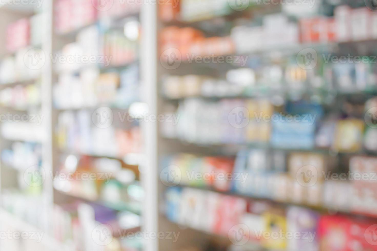 Pharmacy blur background with medicine on shelves photo