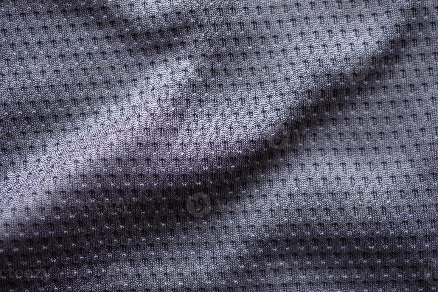 Gray fabric sport clothing football jersey with air mesh texture background photo