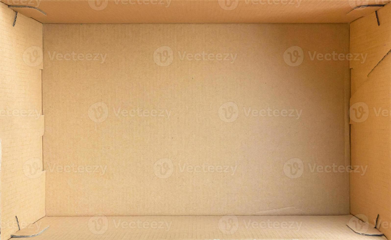 Open empty brown cardboard box background top view photo