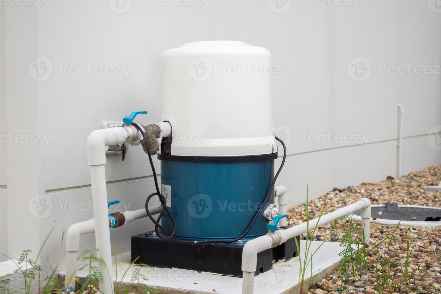 automatic water pump station outside the house photo