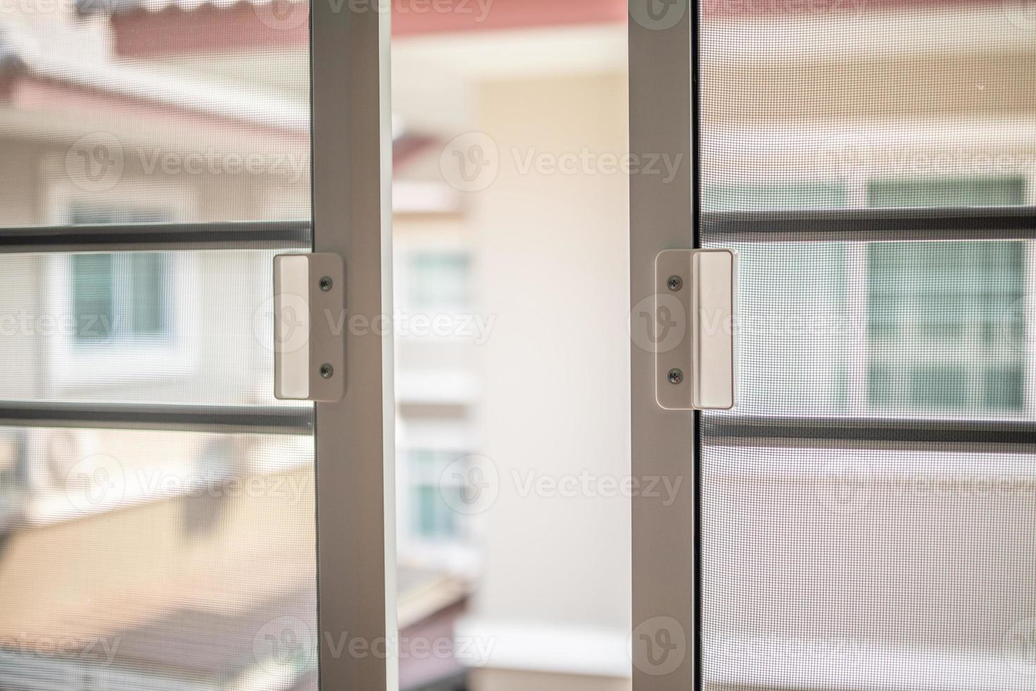 mosquito net wire screen on house window protection against insect photo