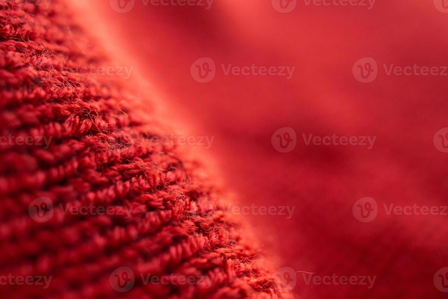 closeup red knitted woolen fabric texture background photo