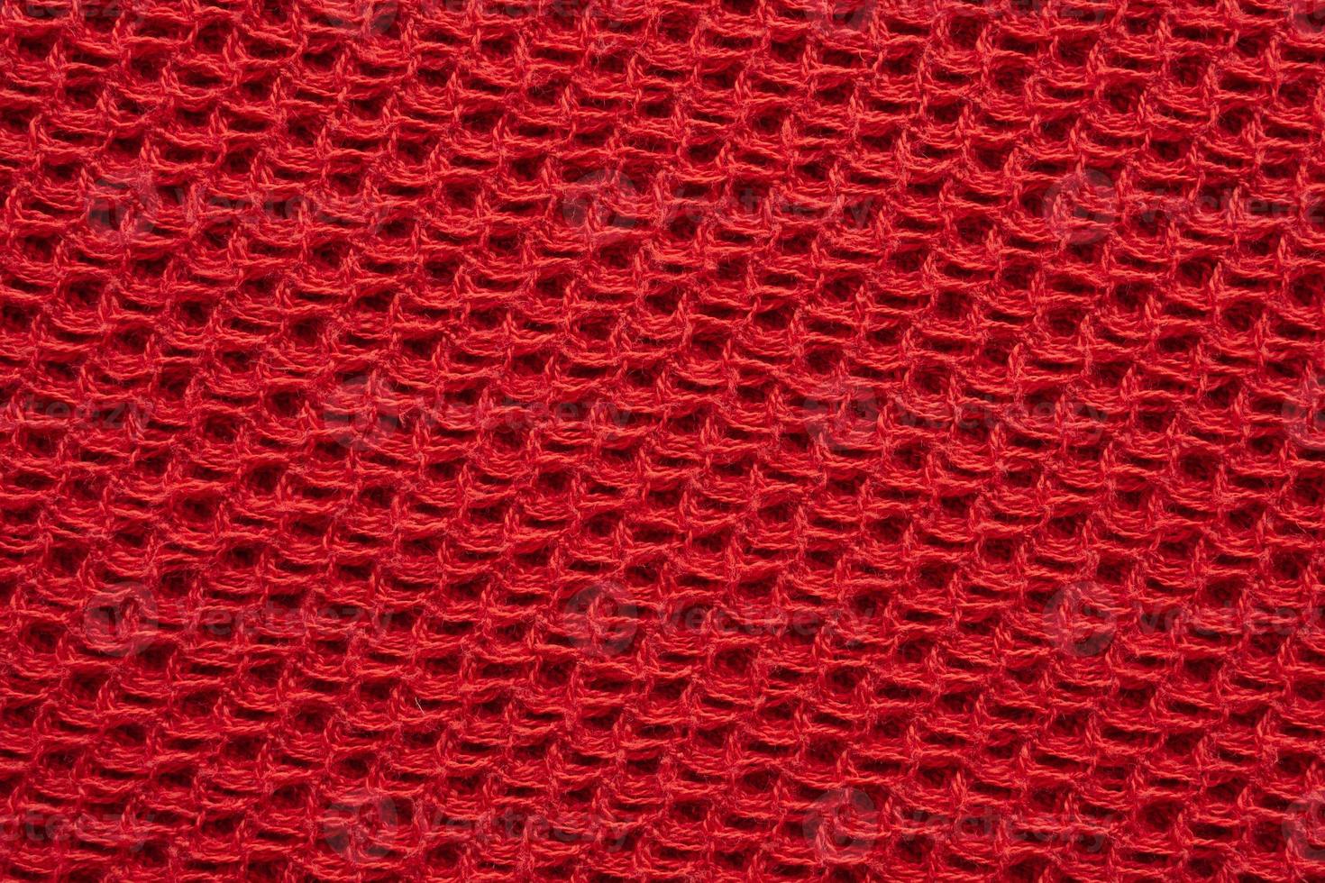 Red knitted cloth wool texture surface background photo