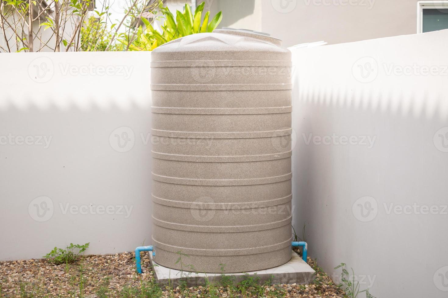 Water storage tank outside the house photo